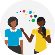 Two colleagues talking with DiSC bubbles between them.
