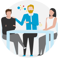 Group of coworkers sitting at a table talking representing alignment.