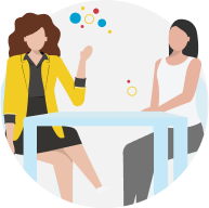 Sales person talking with a customer at a table representing customer mapping.